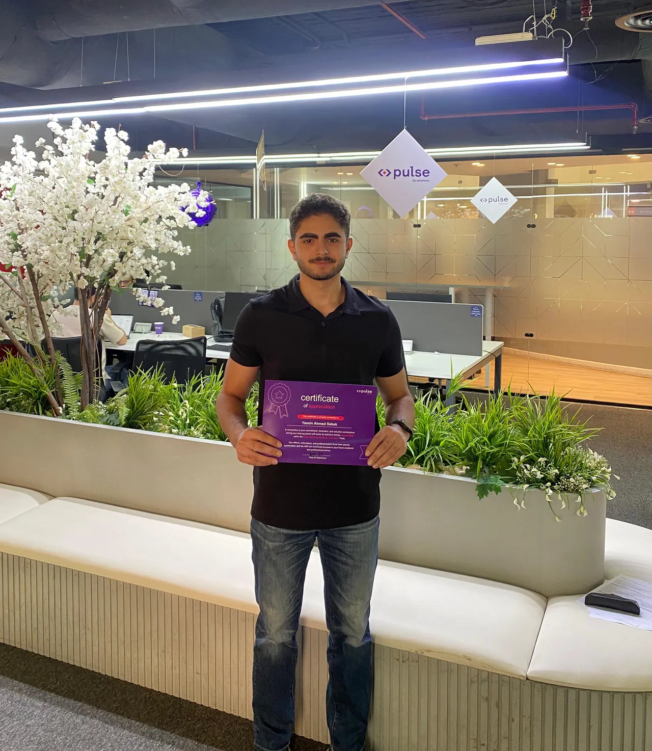 Certificate of appreciation at the end of the internship, on the office floor.
